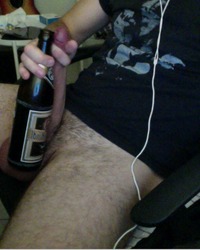 10 inch soft cock stretched next to 11 inch bottle