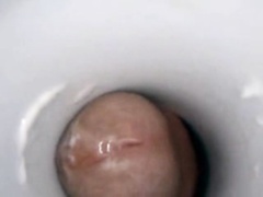 Cock cumming in a fleshlight tube