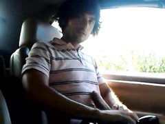 Guy jerking big cock in his car