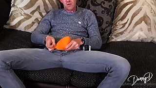 A big-dicked Danny D strokes his massive cock on the couch